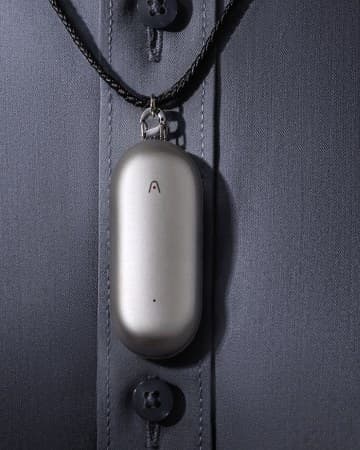 A compact recorder worn on a badge lanyard
