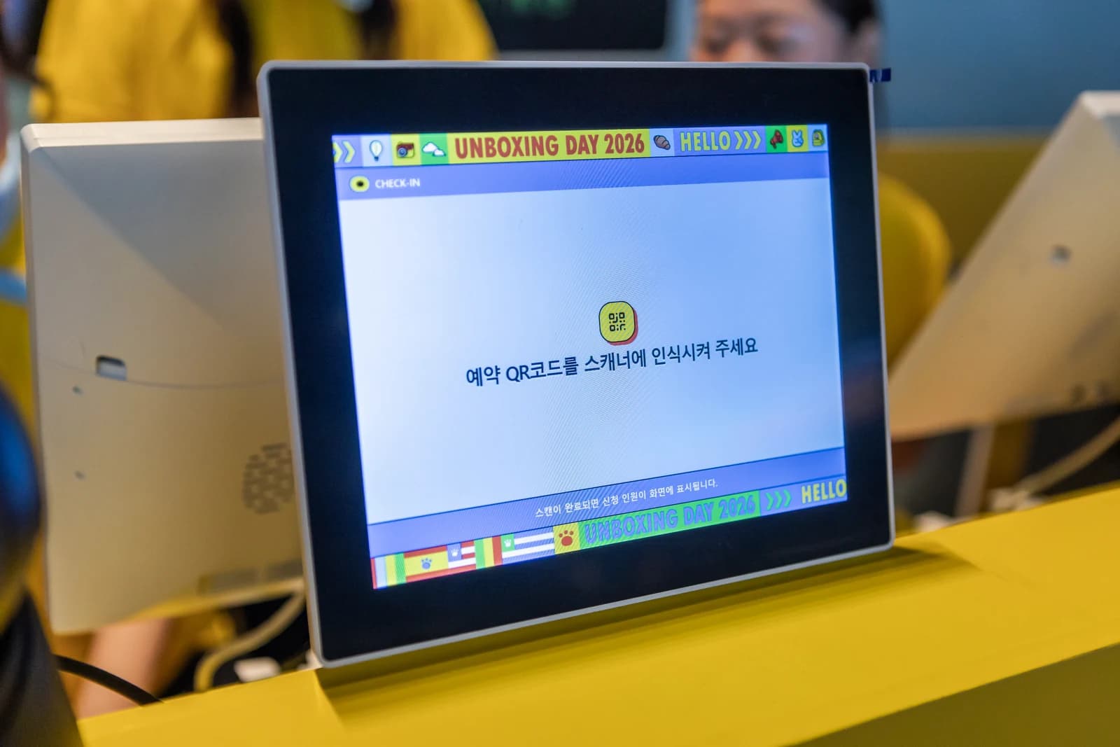 A participant presenting a QR code for check-in roster lookup